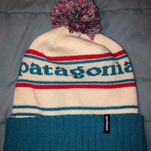 blue, white, and red PATAGONIA beanie